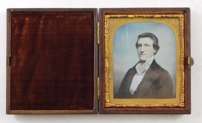 Four 19thC and later portrait miniatures, comprising a pair of miniatures depicting gentleman with long hair and dress, 4cm x 3cm, in ebonised frame with Scottish thistle hangers, a print of a lady, 7.5cm x 6cm, and a coloured photograph. (4) - 3