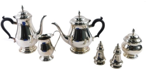 20thC silver plated wares, comprising a silver plated and copper four piece tea and coffee set, comprising teapot, coffee pot, milk jug, and sugar bowl, stamped Sheffield England, and a pair of unmarked silver plated salt and pepper pots. (6)