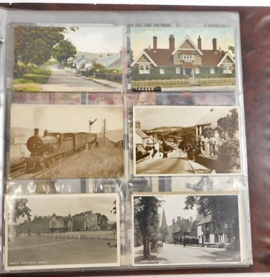 A 20thC postcard album, to include black and white postcards of town scenes, a To My Dear Mother silk postcard, military portrait postcards, some later coloured postcards of Lincoln and surrounding villages, enclosed in an album. - 2