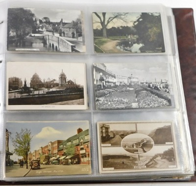 A 20thC postcard album, to include black and white postcards of town scenes, a To My Dear Mother silk postcard, military portrait postcards, some later coloured postcards of Lincoln and surrounding villages, enclosed in an album. - 5