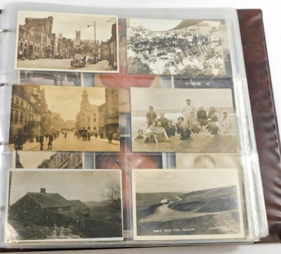 A 20thC postcard album, to include black and white postcards of town scenes, a To My Dear Mother silk postcard, military portrait postcards, some later coloured postcards of Lincoln and surrounding villages, enclosed in an album. - 6