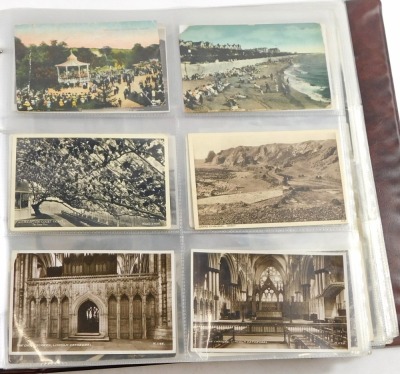 A 20thC postcard album, to include black and white postcards of town scenes, a To My Dear Mother silk postcard, military portrait postcards, some later coloured postcards of Lincoln and surrounding villages, enclosed in an album. - 7