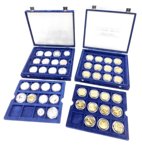 Two cased coin sets, comprising The Legendary Air Craft collection, collector's coins, and The World at War commemorative coin part collection. (2 boxes)