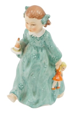 A Goebel figure of a girl in green dress carrying candle, stamped 1951, 15cm high.