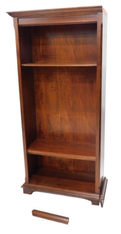 A mahogany open bookcase, of plain design, with moulded cornice and plain frieze, chamfered corners and feet, with three adjustable shelves, 185cm high, 90cm wide, 39cm deep.