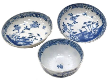 Two 19thC Chinese blue and white saucer dishes, and a tea bowl, all painted with terrace and flowering shrub decoration, the dishes 13.5cm diameter, the tea bowl 8.5cm diameter.