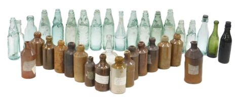 A collection of 19thC and later stoneware and glass bottles, to include Portsmouth, red rose Marlborough, HWHD Rawlings, Junior Army Stores Ltd, etc. (2 trays)