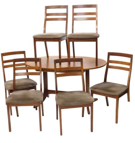 A 1970s Nathan teak oval extending dining table and a set of six ladder back chairs to match, with over upholstered seats in brown draylon.