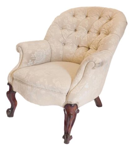 Two Victorian button back upholstered arm chairs, in cream upholstery, one with scroll arms, the other with French cabriole legs.