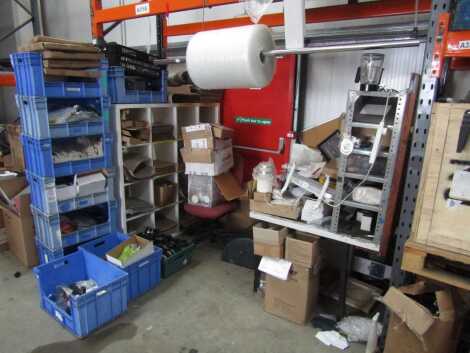 A dispatch packaging bay, including rolls, spares, stationary, wrapping station, tools, etc.