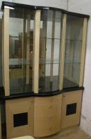 A modern blond wood and ebonised display cabinet