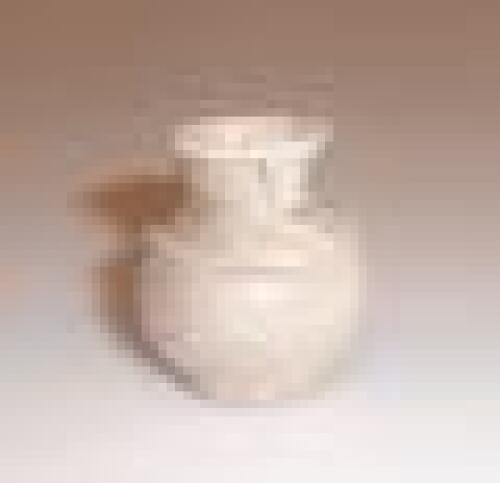 A late Roman pale green glass perfume bottle or unguentarium