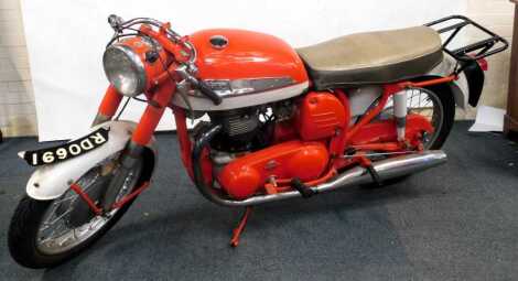 A 1960's Norton Dominator, repainted in orange and white, 13,652 recorded miles, no V5 present.