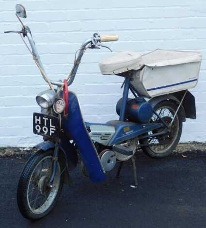 A 1960s Raleigh Wisp motorised pedal moped, Registration HTL 99F, blue, 50cc, petrol, no V5 present.