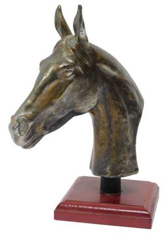 A bronzed horse's head car mascot, mounted on a wooden plinth, 18cm high.