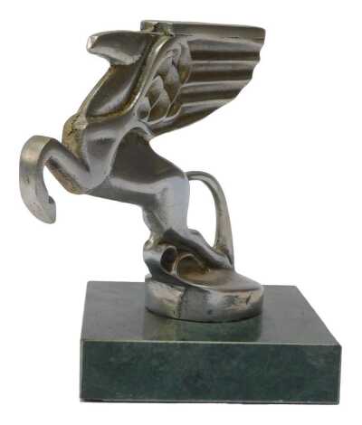 An Amilcar winged Pegasus car mascot, mounted on a green marble base, 12cm high.