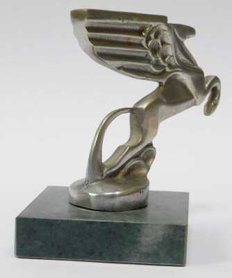 An Amilcar winged Pegasus car mascot, mounted on a green marble base, 12cm high. - 2