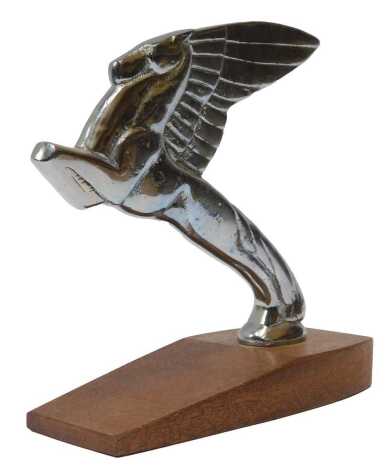 A chromed single winged Pegasus car mascot by Beards of Cheltenham, mounted on a teak base, 1?cm high.