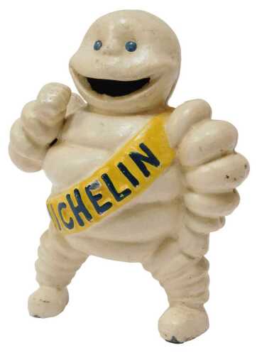 A reproduction cast iron 'Bibendum' Michelin Man figure, 15cm high.