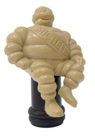 A 1960s Bakelite 'Bibendum' Michelin Man, mounted on a plastic base, 13cm high.