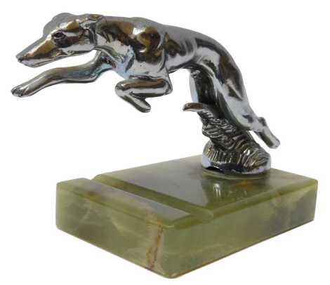 A chrome plate greyhound car mascot, on an onyx base, 10cm high.