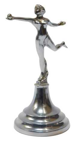 An Eve mascot, with arm outstretched holding an apple, mounted on base, 18cm high.