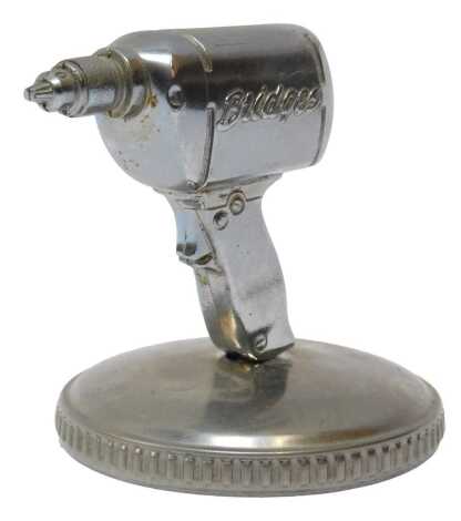 A Stanley Bridges Tool Company Nemic Drill advertising mascot, mounted on a radiator cap, 8cm high.