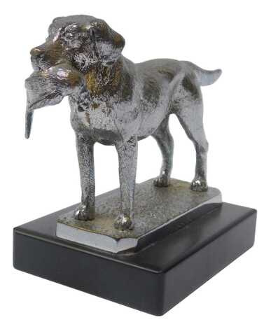 A car mascot modelled as a Labrador with a pheasant in its mouth, mounted on a black base, 11.5cm high.