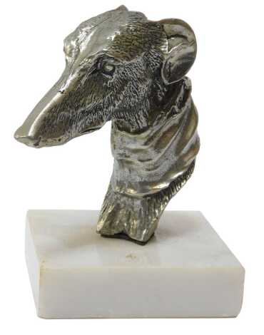 A chrome car mascot in the form of a greyhound's head, mounted on a marble base, 11cm high.