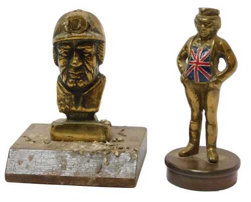 Brass car mascots, including a miner on wooden plinth and John Bull. (2)