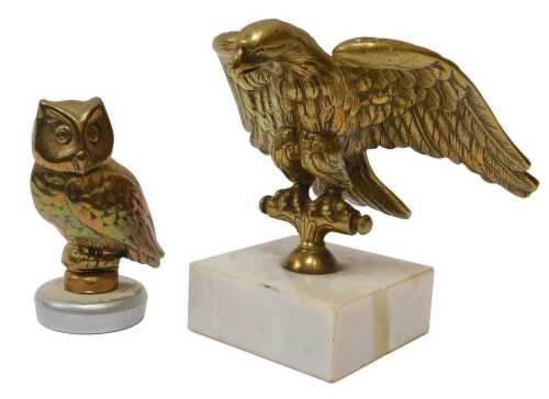 Brass mascots, including brass eagle flag pole topper mounted on a marble base, and an owl mascot. (2)