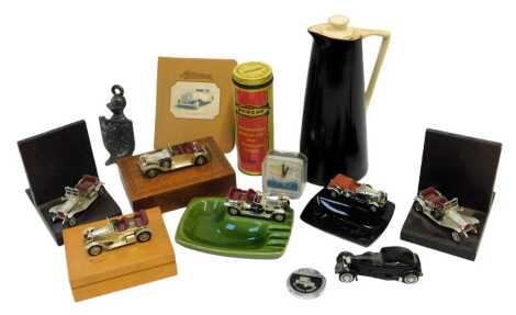 A group of automobile related collectables, to include diecast vehicle mounted pottery ashtrays, a Dunlop Reddiplug repair kit for tubeless tyres, a Goodyear Chiltern vacuum pottery jug, bookends, etc. (1 tray)