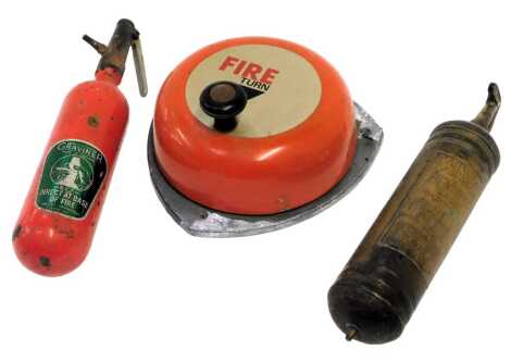 A manual fire alarm bell, 23cm wide, together with two fire extinguishers.