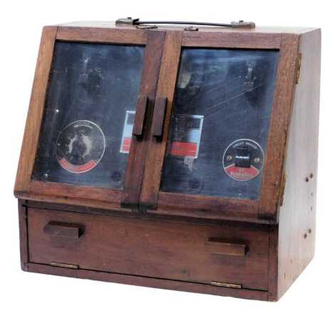 An electrical flash tester, in oak case with carrying handle, 36cm high.