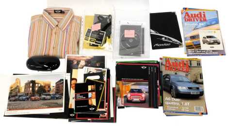 Mini Cooper related items, to include an Invite to the Screening of The Italian Job Remake 2003, various pamphlets, car mounted sunglasses case, Mini striped shirt size XL, together with various Audi Driver magazines, Ford Mondeo notebook, etc. (2 boxes)