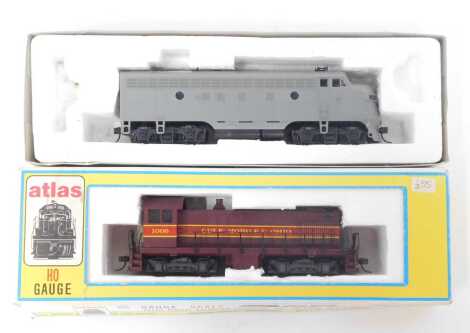 An Atlas HO gauge locomotive, S-2 diesel, 8083, Gulf, Mobile and Ohio 1006, boxed, together with a Stuart Hobbies 5311 diesel locomotive, partially boxed.