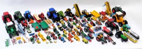 Britain's, Ertl and other diecast farming implements and tractors, including Britain's Valtra Valmet 115 tractor, ??, Tuppertoys Barber Greene Holding elevator loader, Ertl Thomas the Tank Engine characters, etc. (contents of 1 box)