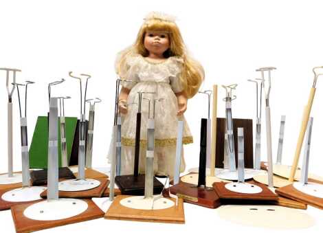 Various doll stands on wooden plinths, etc. (1 box)