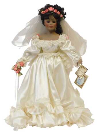 An Alberon collector's dolls porcelain doll Claudette, in wedding dress, 24", with stand.