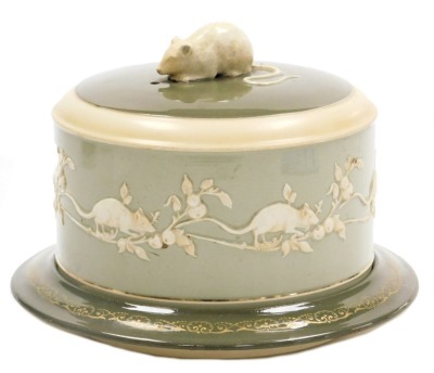 A late 19thC/early 20thC James MacIntyre and Company Limited pottery cheese dish and cover, Washington Faience range, the cover with a mouse finial, and decorated inside with a band of repeating mice and fruit, raised on a base with gilt decoration, print