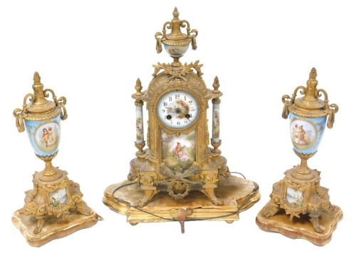 A late 19thC French brass and porcelain clock garniture, the clock with circular porcelain dial, painted with Arabic numerals, eight-day movement, with bell strike, the case with an urn finial, central plaque painted with a courting couple, raised on four