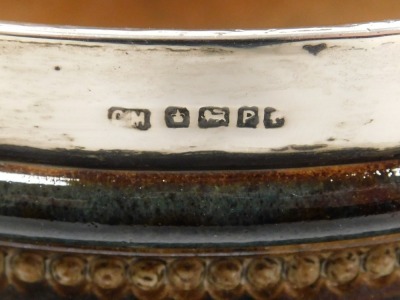 A late 19thC Doulton Lambeth stoneware bowl, with silver mount, sprigged with repeating bands of leaves and stylised flowers, impressed marks, Sheffield 1882, 22cm wide. - 3