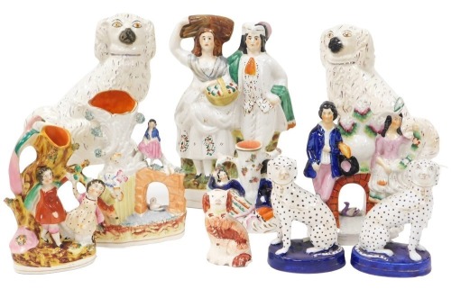 A group of 19thC Staffordshire figures and spill vases, together with a pair of Spaniels, pair of Dalmations, and a further dog. (a quantity)