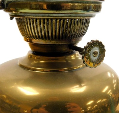 An early 20thC Sherwood Ltd brass oil lamp, with a frilled clear glass shade, 40cm high, together with a further brass oil lamp, possibly from a standard lamp, with glass chimney, 50cm high. (2) - 2