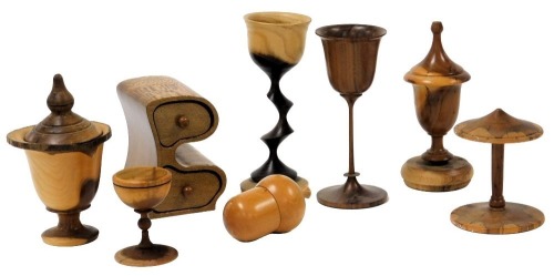 A group of 20thC treen, including carved wine cups, spool, egg cup, acorn box, and a partridge wood two drawer box. (a quantity)