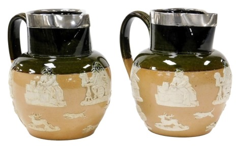 A pair of late 19thC Doulton Lambeth stoneware two tone harvest jugs, in green and fawn, with silver rims, impressed marks, London 1898, 19cm high.