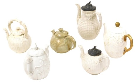 Four 19thC white glazed relief moulded teapots, including Copeland, a studio pottery teapot, and a Coalport porcelain teapot, white glazed, moulded with scallop shells and seaweed. (6)