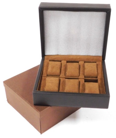 A Constantin Weisz brown leather watch box, with six fitted compartments, with lidded outer box, 23cm wide, 20cm deep.