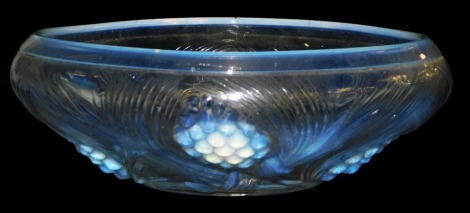 An early 20thC Jobling opalescent glass bowl, decorated with fir cones, 24cm wide.