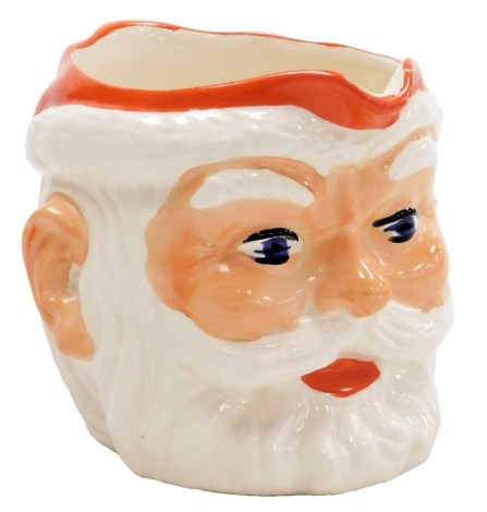 A 1960s pottery Santa Claus Bird's Custard jug, 10cm high.